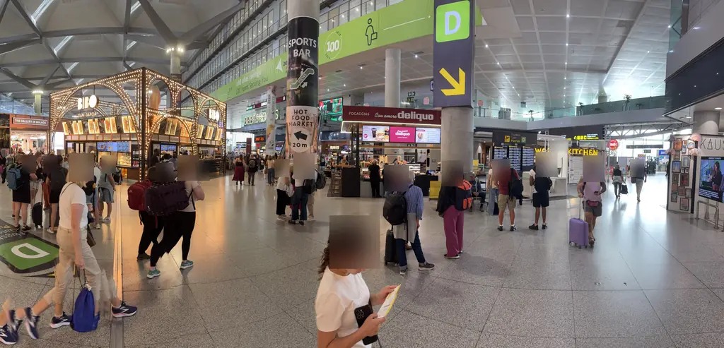 Food court with bars and food counters near the D gates at Málaga Airport