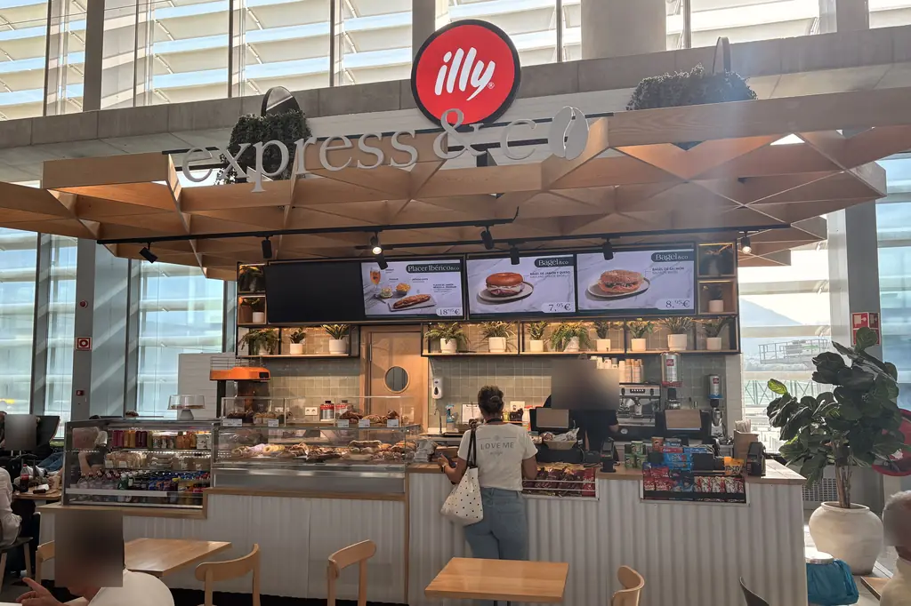 illy express & co café counter with sandwiches and pastries at Málaga Airport